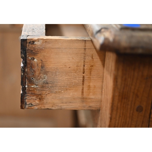 205 - An antique provincial oak dresser base with two drawers over panelled cupboardsmissing one bracket f... 