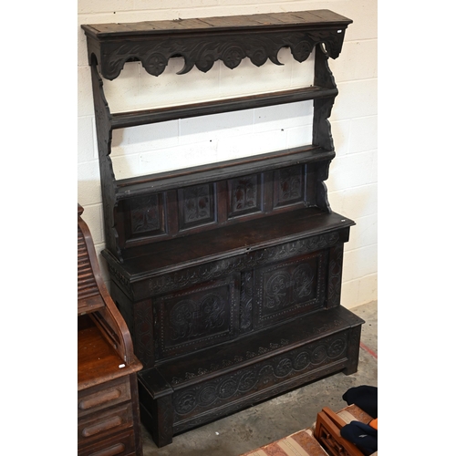 207 - #An antique Continental carved oak dresser in dark stained finish, 136 cm wide x 55 cm deep x 200 cm... 