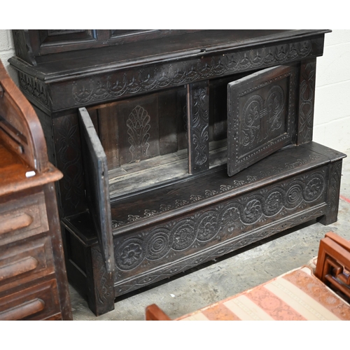 207 - #An antique Continental carved oak dresser in dark stained finish, 136 cm wide x 55 cm deep x 200 cm... 