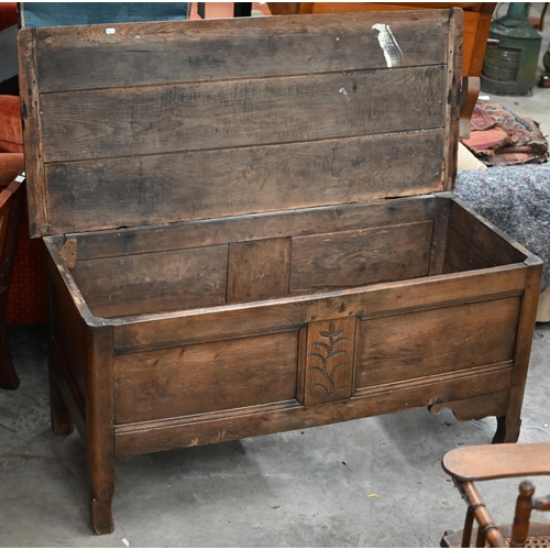 208 - An antique oak coffer/blanket chest of panelled construction with hinged top, 136 cm wide x 58 cm de... 