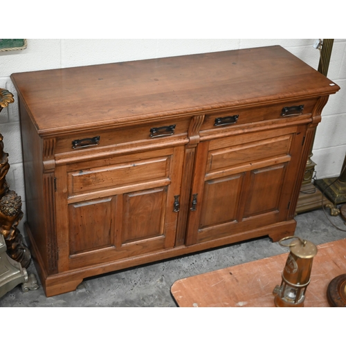 210 - A stained hardwood sideboard or dresser base with two drawers over panelled cupboards on bracket fee... 