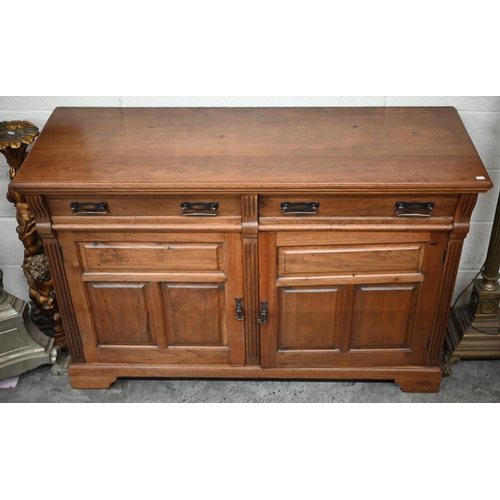 210 - A stained hardwood sideboard or dresser base with two drawers over panelled cupboards on bracket fee... 