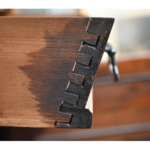 210 - A stained hardwood sideboard or dresser base with two drawers over panelled cupboards on bracket fee... 