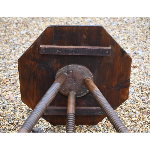 211 - A provincial octagonal side table on ring turned stained beech base, 55 cm wide x 70 cm high