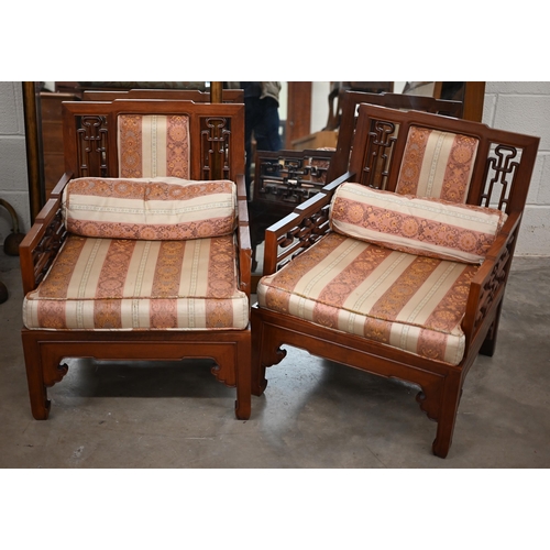 215 - A pair of 20th century Chinese hardwood low armchairs