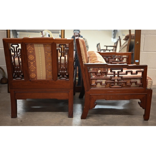 215 - A pair of 20th century Chinese hardwood low armchairs