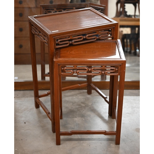 217 - A nest of two 20th century Chinese hardwood tables, the largest 36 x 46 x 68 cm high