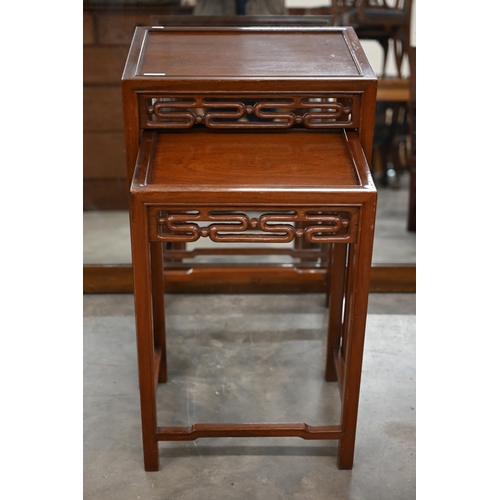 217 - A nest of two 20th century Chinese hardwood tables, the largest 36 x 46 x 68 cm high