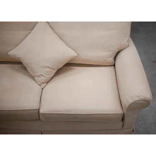 218 - A Duresta two seater scroll-arm sofa in beige fabric with loose covers, 178 x 96 x 90 cm high