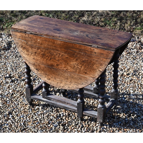 222 - #An antique oak drop-leaf dining table on bobbin-turned gate leg action base, 106 x 90 x 72 cm high