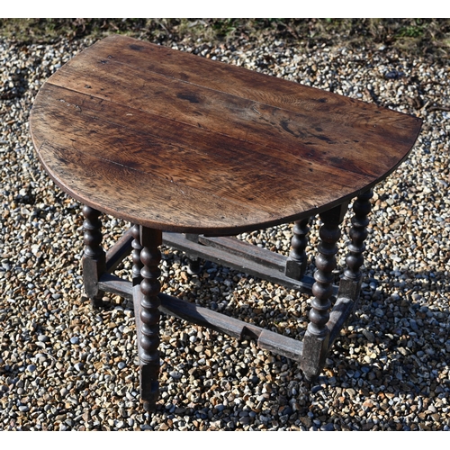 222 - #An antique oak drop-leaf dining table on bobbin-turned gate leg action base, 106 x 90 x 72 cm high