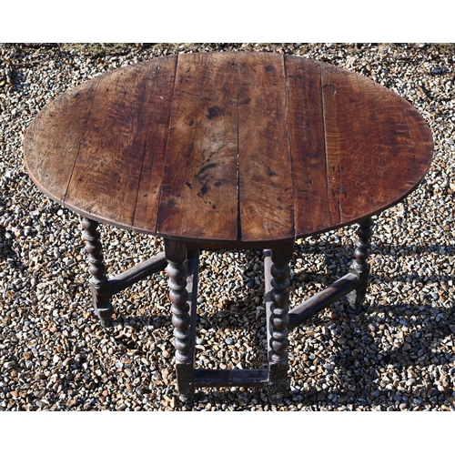 222 - #An antique oak drop-leaf dining table on bobbin-turned gate leg action base, 106 x 90 x 72 cm high