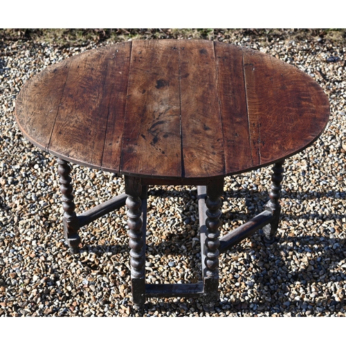 222 - #An antique oak drop-leaf dining table on bobbin-turned gate leg action base, 106 x 90 x 72 cm high