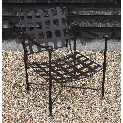 223 - A wrought iron Bugatti style indoor/outdoor reclining armchair with lattice seat and chain supported... 