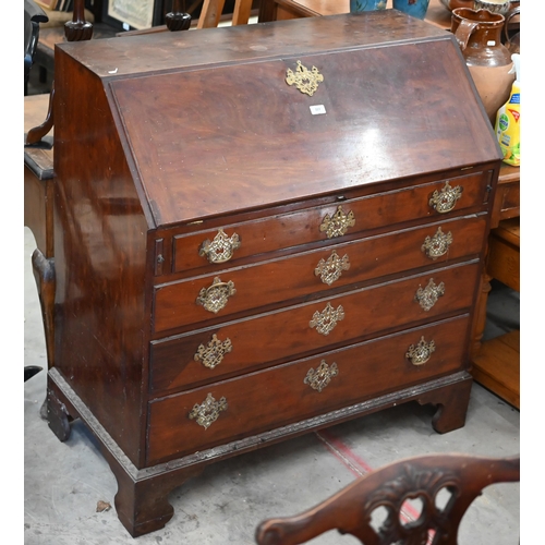 227 - #A George III mahogany fall front bureau with fitted interior over four long graduating drawers rais... 