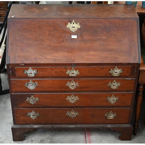 227 - #A George III mahogany fall front bureau with fitted interior over four long graduating drawers rais... 