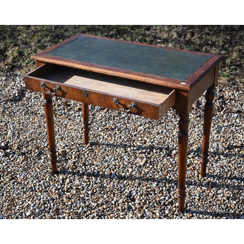 228 - A 19th century walnut writing table with green leather top, single frieze drawer and turned supports... 