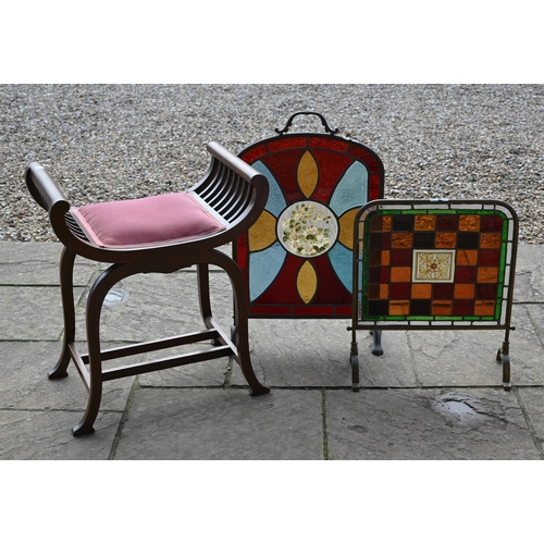 236 - An Edwardian walnut stool with pink dralon seat to/w two brass frmaed firescreens with stained glass... 