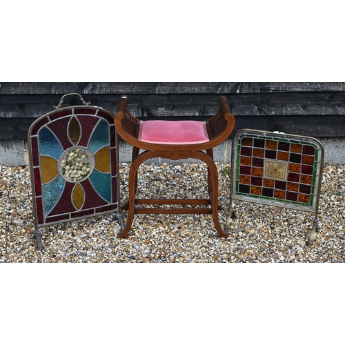 236 - An Edwardian walnut stool with pink dralon seat to/w two brass frmaed firescreens with stained glass... 