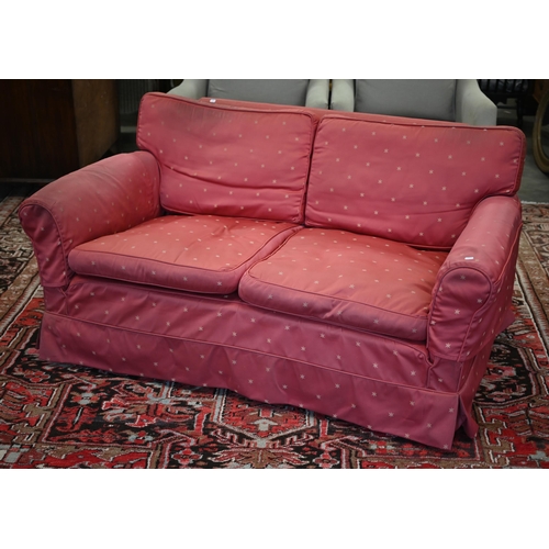 238 - A vintage deep-seated sofa with fitted loose cover and squab cushions, 168cm wide x 100cm deep