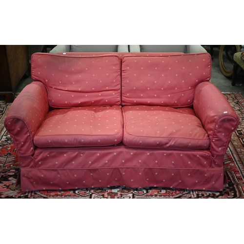 238 - A vintage deep-seated sofa with fitted loose cover and squab cushions, 168cm wide x 100cm deep