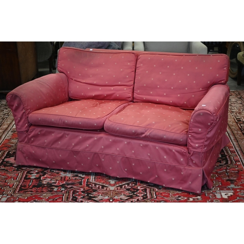 238 - A vintage deep-seated sofa with fitted loose cover and squab cushions, 168cm wide x 100cm deep