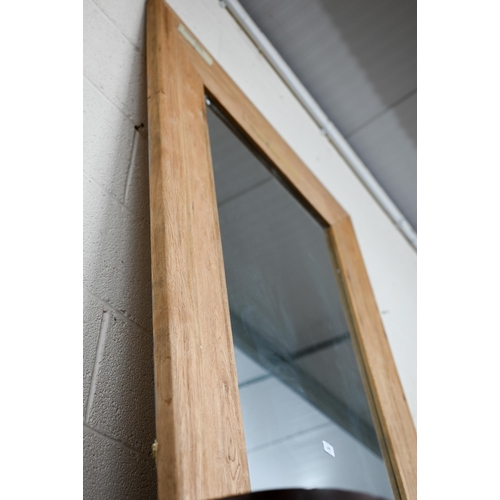 243 - A large rectangular mirror in moulded ash frame, 150 x 100 cm