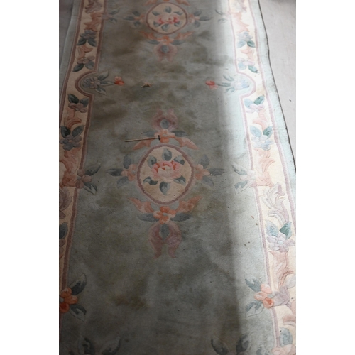 258 - A Chinese cut wool floral runner, teal ground, 244 x 79 cm