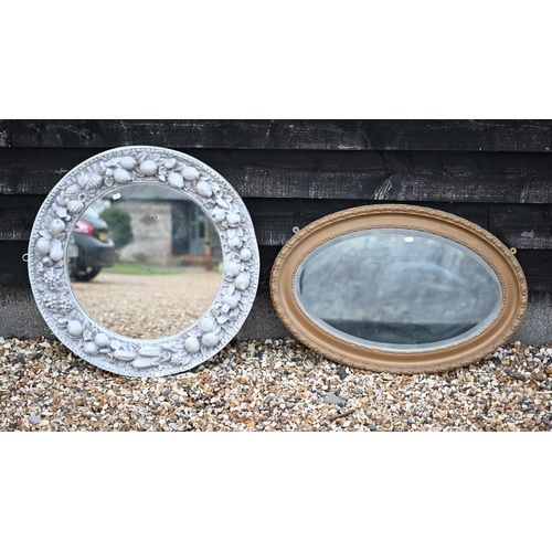 259 - #A circular wall mirror in grey painted (overgilt) wooden and gesso frame moulded with fruit to/w a ... 