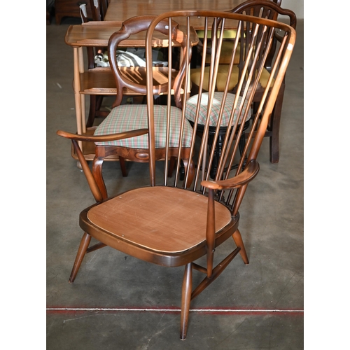 263 - An Ercol dark elm spindle back Windsor armchair, frame onlyNon-compliant foam cushions removed... 