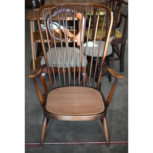 263 - An Ercol dark elm spindle back Windsor armchair, frame onlyNon-compliant foam cushions removed... 