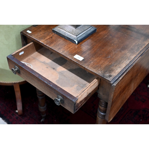 266 - A 19th century mahogany drop-leaf table with end drawer and turned supports