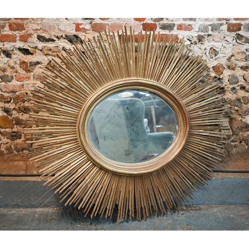 269 - A large bevelled oval wall mirror in 'sunburst' gilt frame, 135 x 145 cm