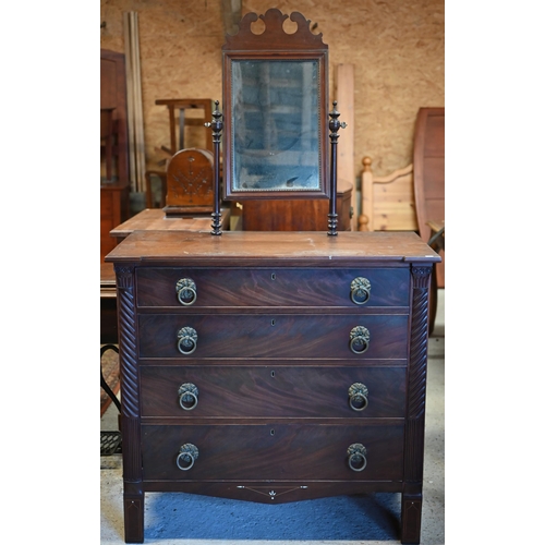 27 - An early 19th century mahogany chest of four long graduated drawers with brass furniture, a toilet m... 