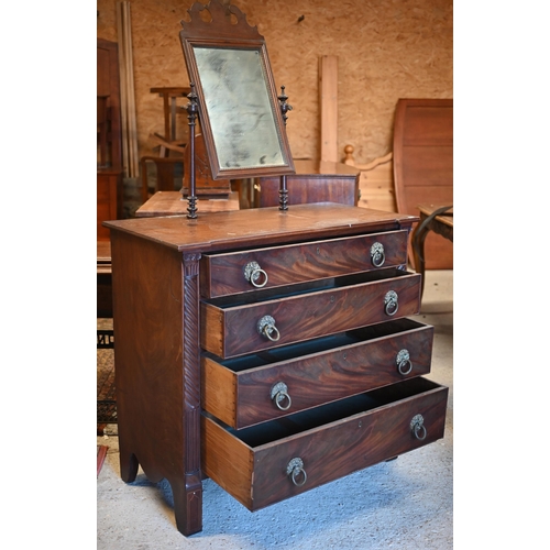 27 - An early 19th century mahogany chest of four long graduated drawers with brass furniture, a toilet m... 