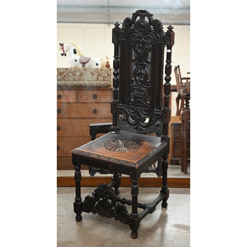 274 - A 19th century carved oak hall chair in the 17th century manner