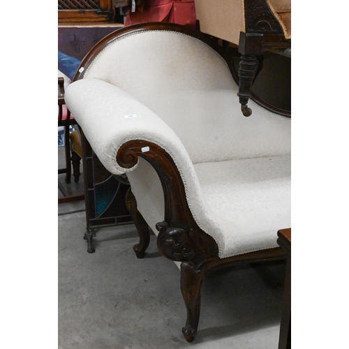 276 - A mahogany framed scroll-end chaise with shaped back, acanthus carved shaped legs, foliate upholster... 