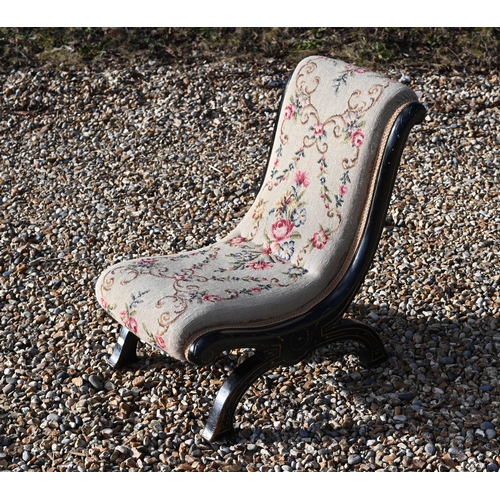 284 - A Victorian ebonised needlepoint slipper chair