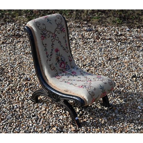 284 - A Victorian ebonised needlepoint slipper chair