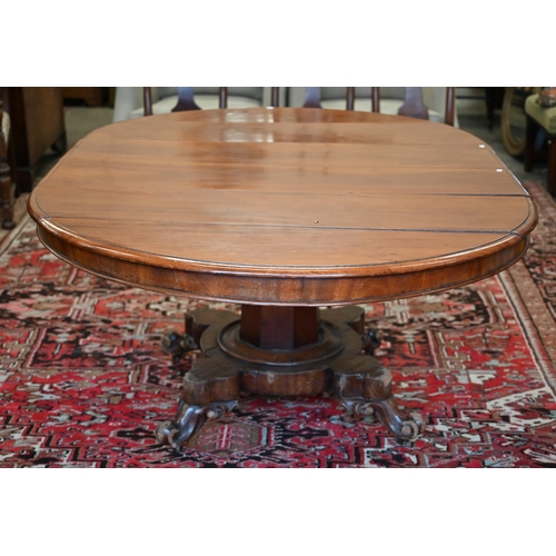 285 - A late 19th century mahogany extending circular dining table on tapering octagonal column and quadra... 