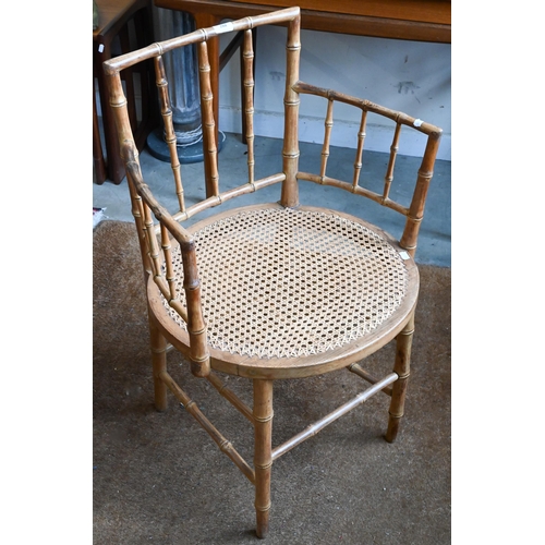 288 - A beech simulated bamboo framed elbow chair with caned seat