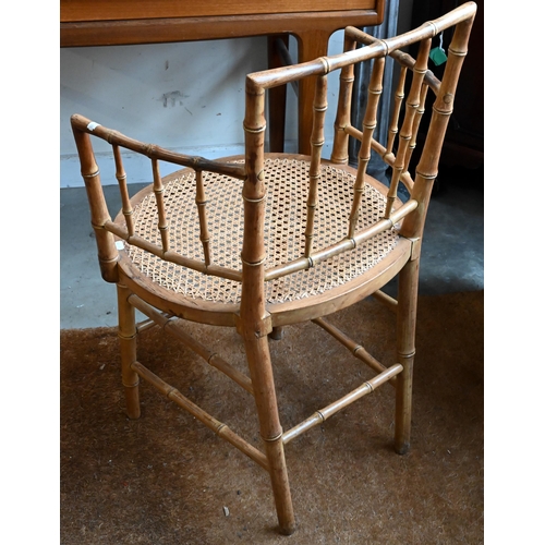 288 - A beech simulated bamboo framed elbow chair with caned seat