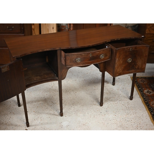 29 - #An antique mahogany serpentine front sideboard, centred by a drawer flanked by a cupboard and deep ... 