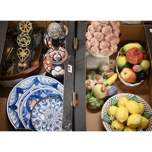 358 - Two faience baskets of fruit, a vase stacked with garlic and a bundle of vegetables to/w various maj... 