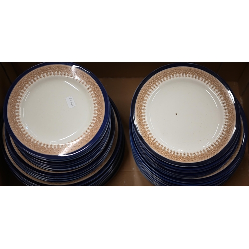 372 - A late Victorian Royal Worcester dinner service with painted sepia Gothic Revival borders and blue r... 