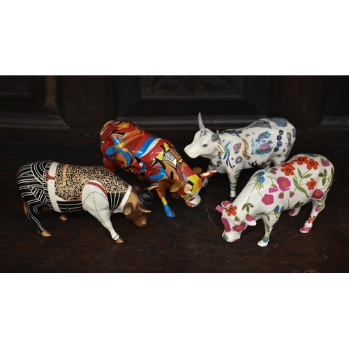 389 - Four 'cow parade' decorative ceramic cows (1 a/f)