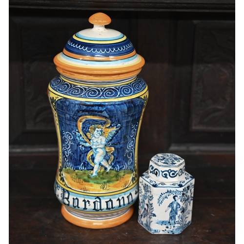 390 - A reproduction majolica drug jar and cover, painted with an angel, 31 cm high to/w a Delft blue and ... 