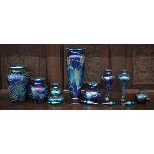 391 - A collection of Okra Art Nouveau style iridescent glass including five scent bottles and stoppers an... 