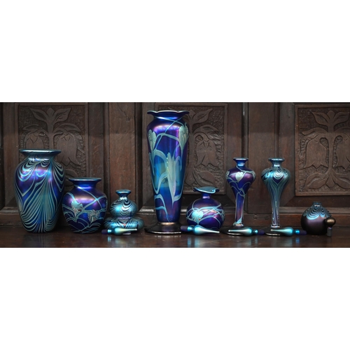 391 - A collection of Okra Art Nouveau style iridescent glass including five scent bottles and stoppers an... 