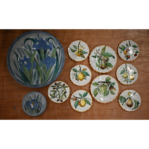 392 - Seven Cantagali majolica small plates and two larger examples, painted with fruit to/w a Highland St... 